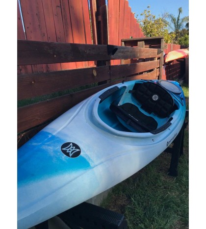 Perception sit-inside kayak used with Werner paddle