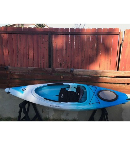 Perception sit-inside kayak used with Werner paddle