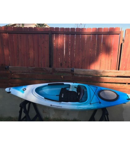 Perception sit-inside kayak used with Werner paddle